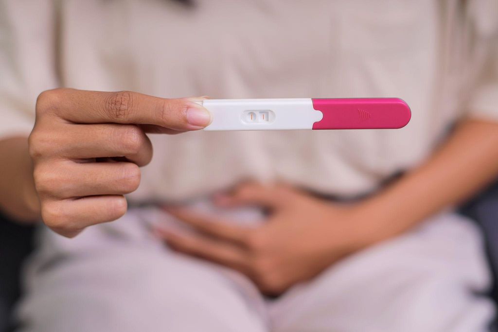 A selection of pregnancy tests, including digital and strip options, alongside antenatal vitamins.