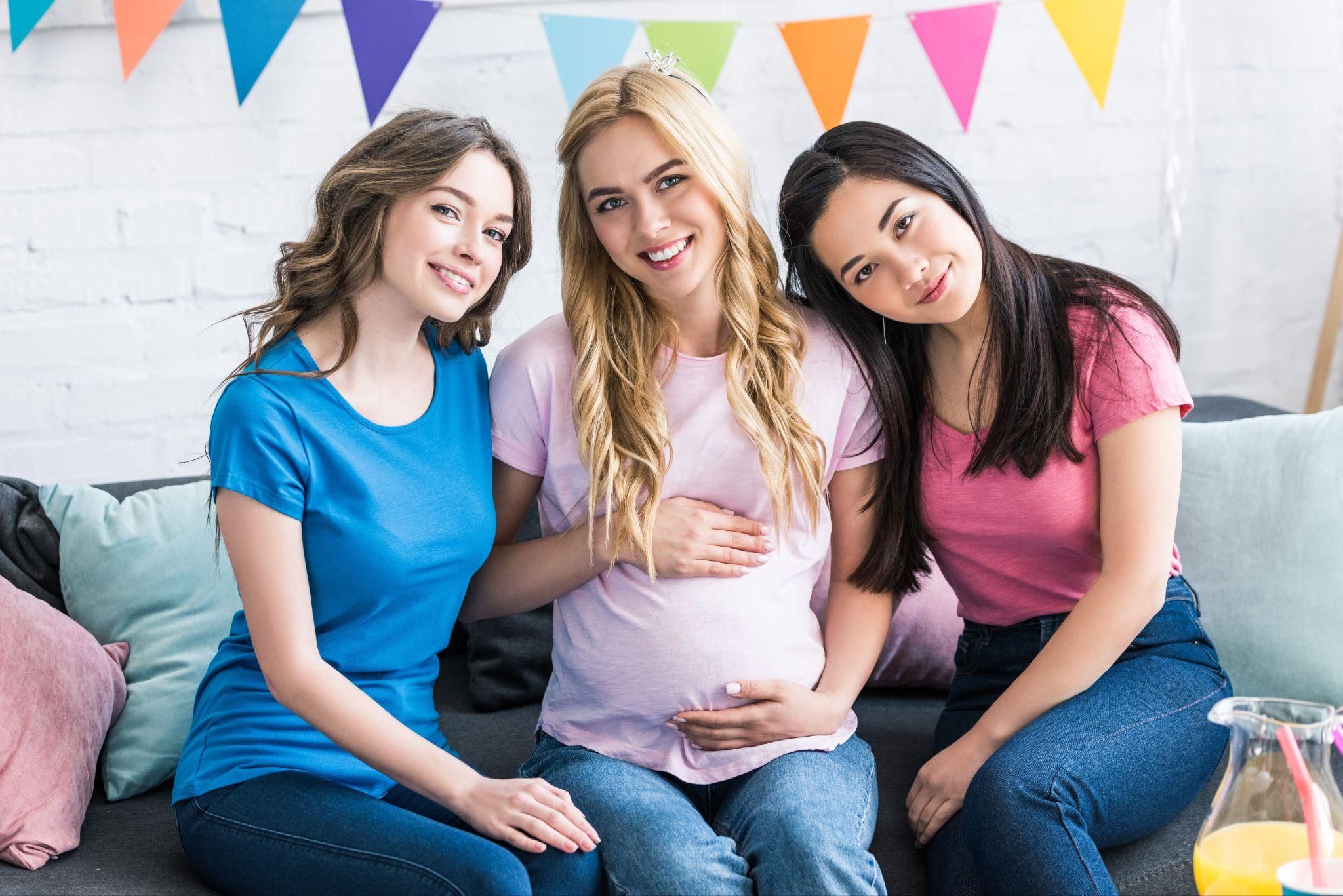 Pregnant woman receiving support from family or friends.