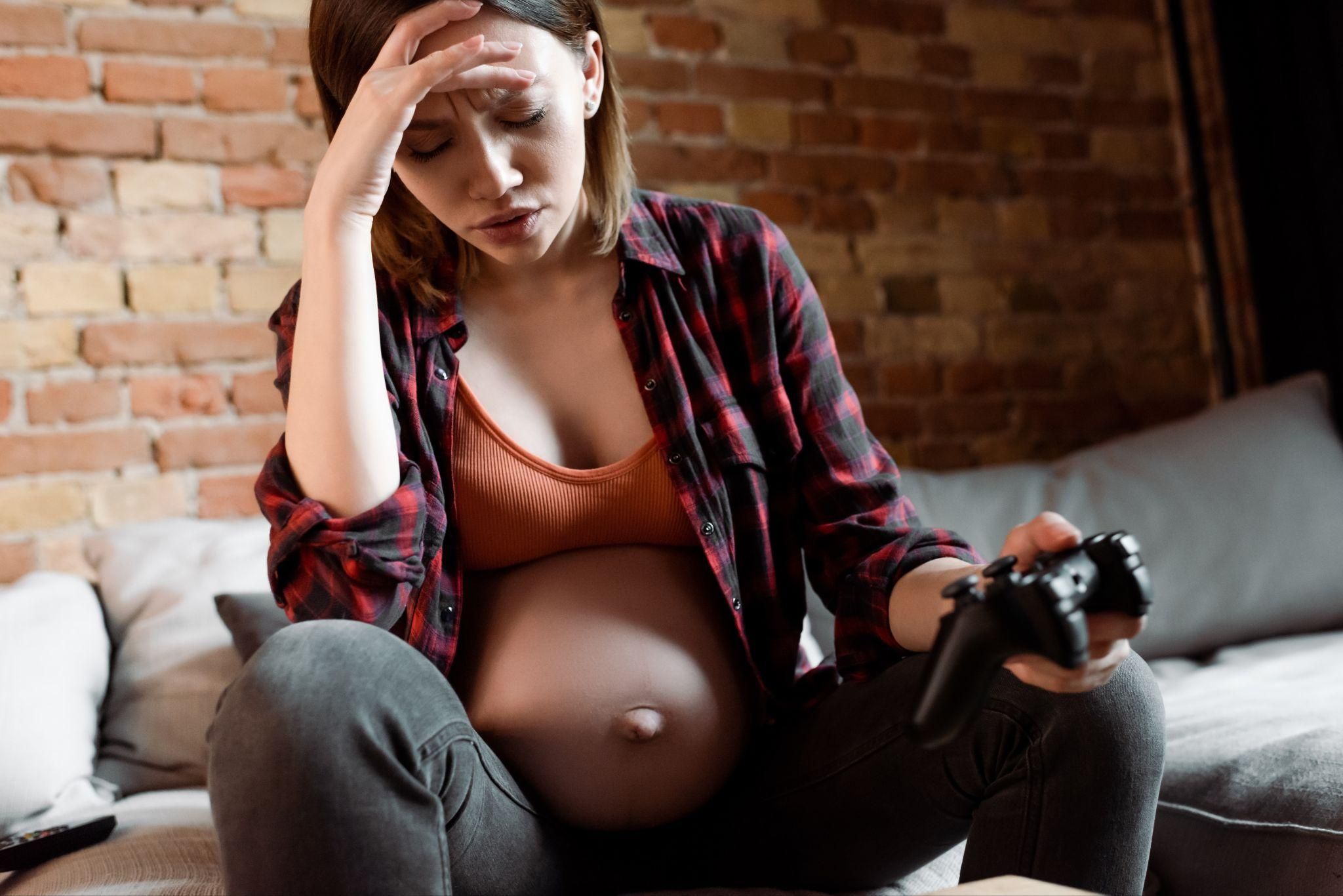 A healthcare professional discussing antenatal complications with a pregnant woman.