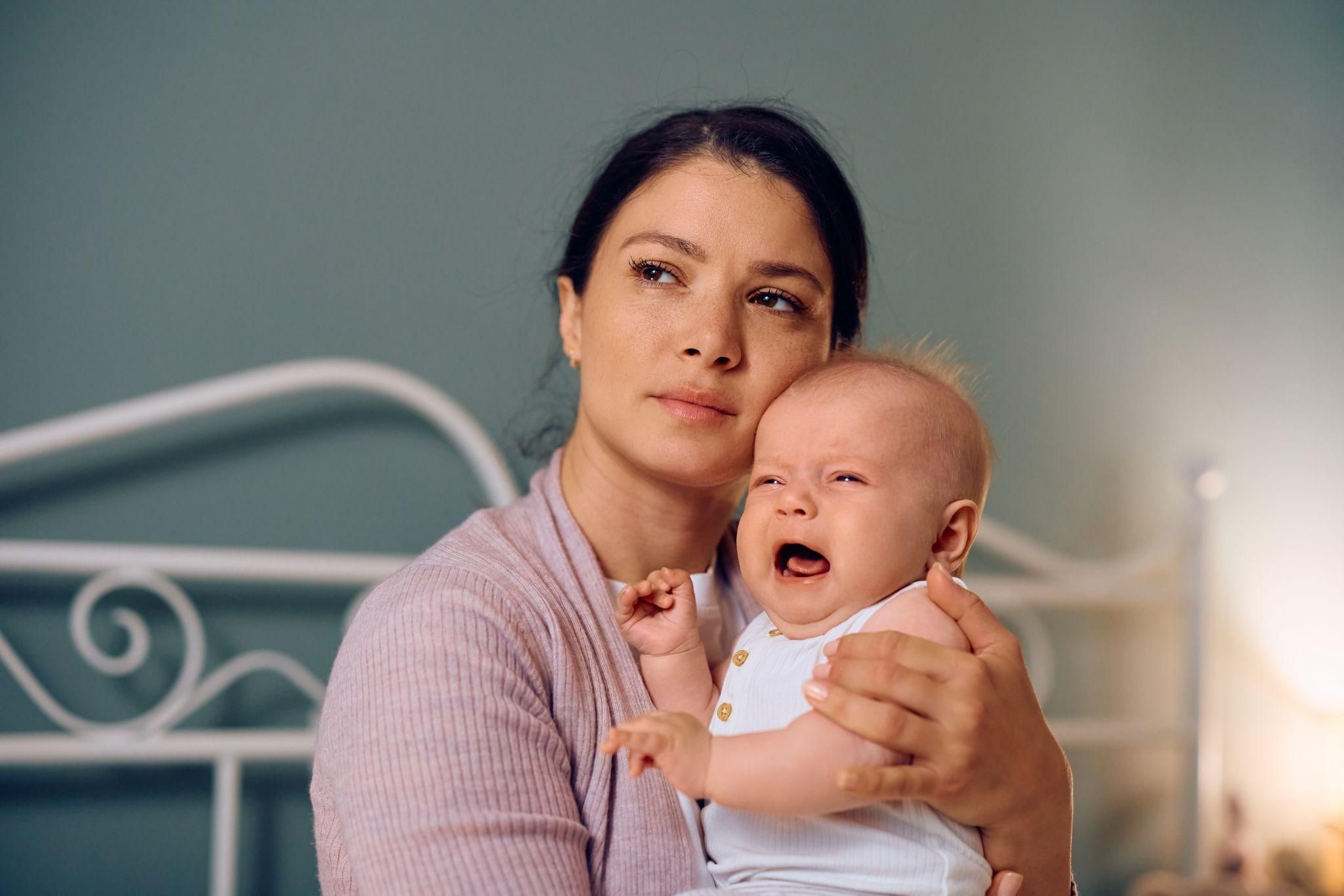 Pregnancy woman with partner, sharing intimacy without physical interaction.