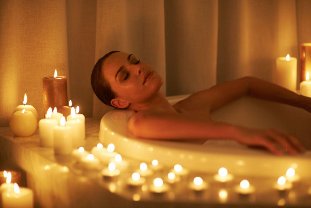 Pregnant woman relaxing in a warm bath to ease pregnancy discomfort.