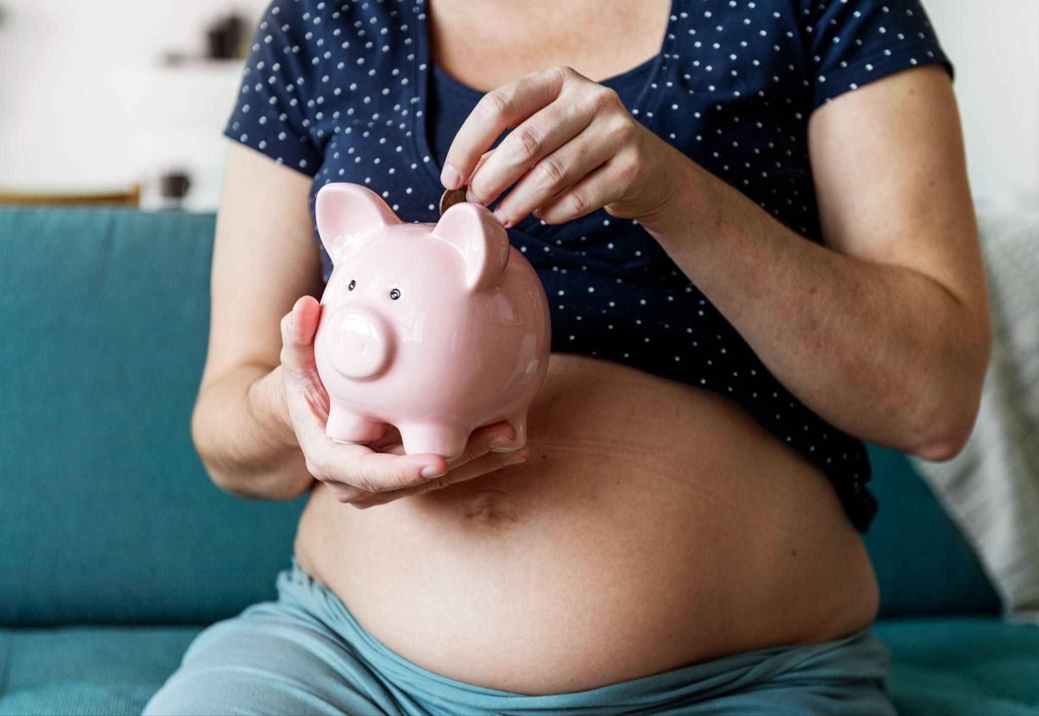 Expectant parent saving money while choosing baby essentials.