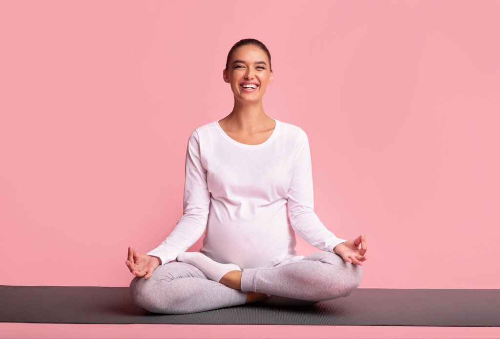 Pregnant woman practicing yoga