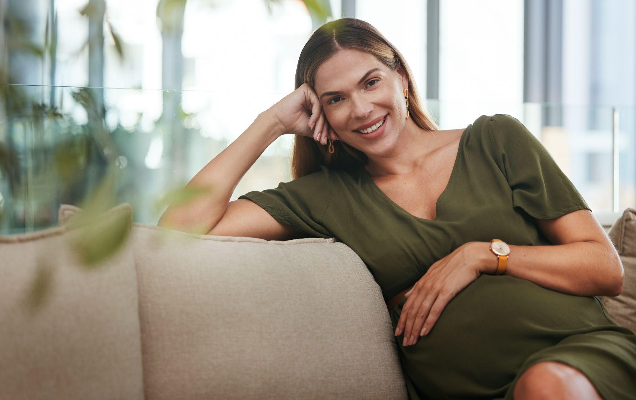 A mother-to-be discussing her antenatal care with an NHS midwife.