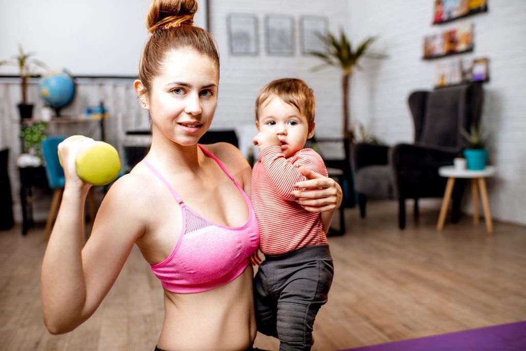 Mother embracing her post-baby body while enjoying a walk with her baby.