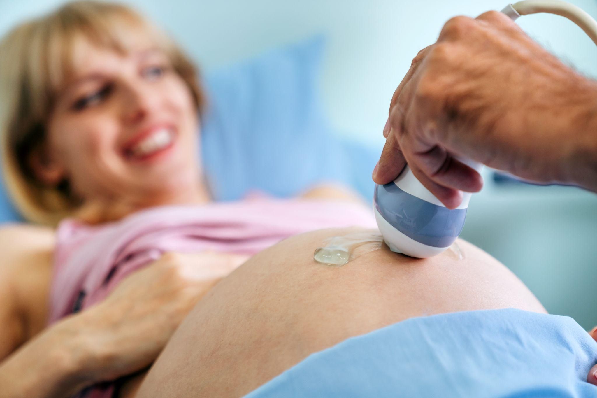 Pregnant woman attending an antenatal appointment for fibroids monitoring.