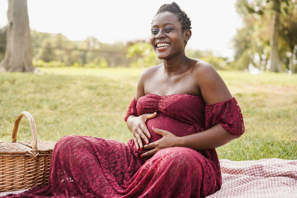 A husband supporting his wife during labour, offering reassurance and comfort.