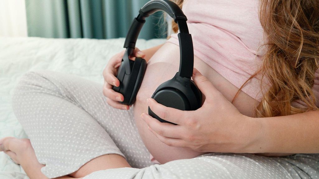 Expectant mother enjoying relaxation while talking to her baby, creating a calm environment.