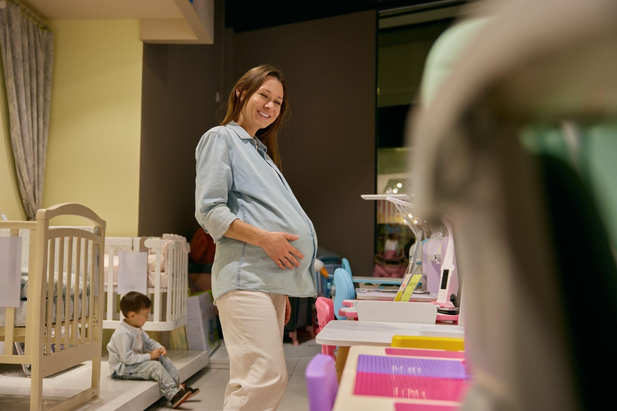 A collection of baby essentials, including a cot, changing mat, and baby monitor.