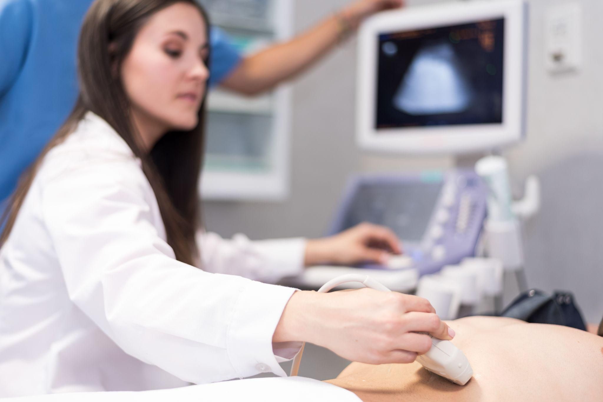 A pregnant woman receiving an ultrasound scan at an antenatal clinic, symbolising the importance of antenatal care during viability week.