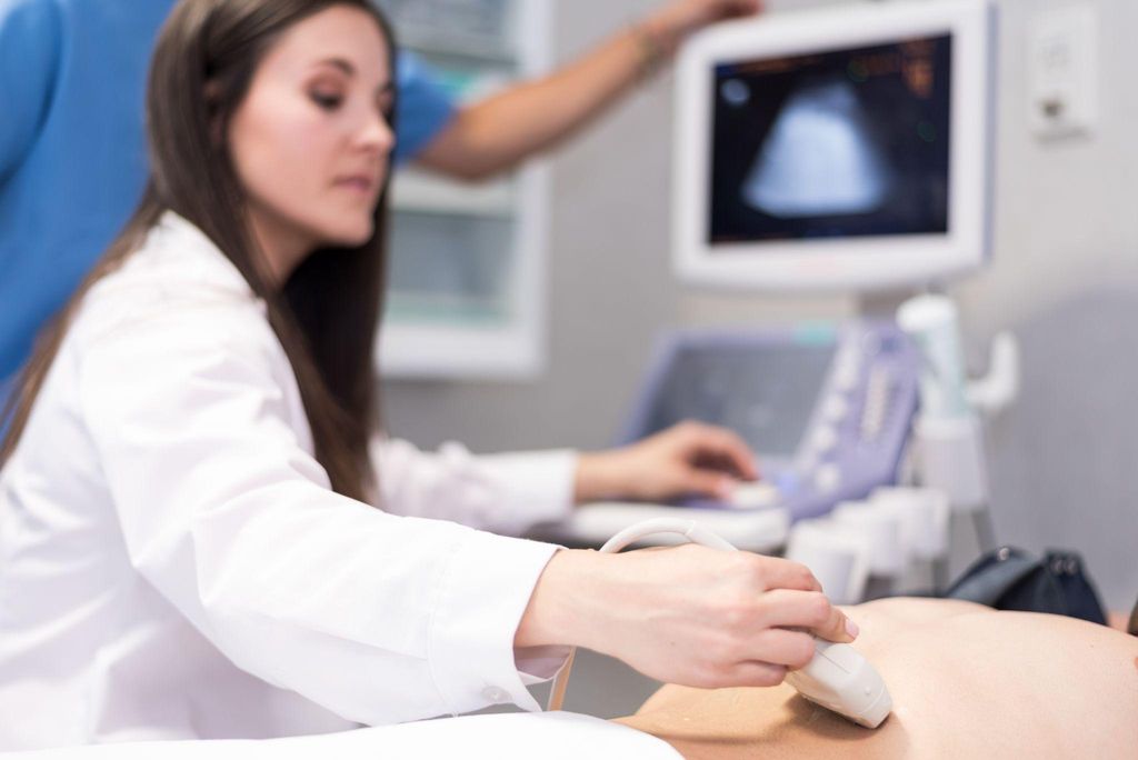 A healthcare professional performing an advanced antenatal ultrasound.