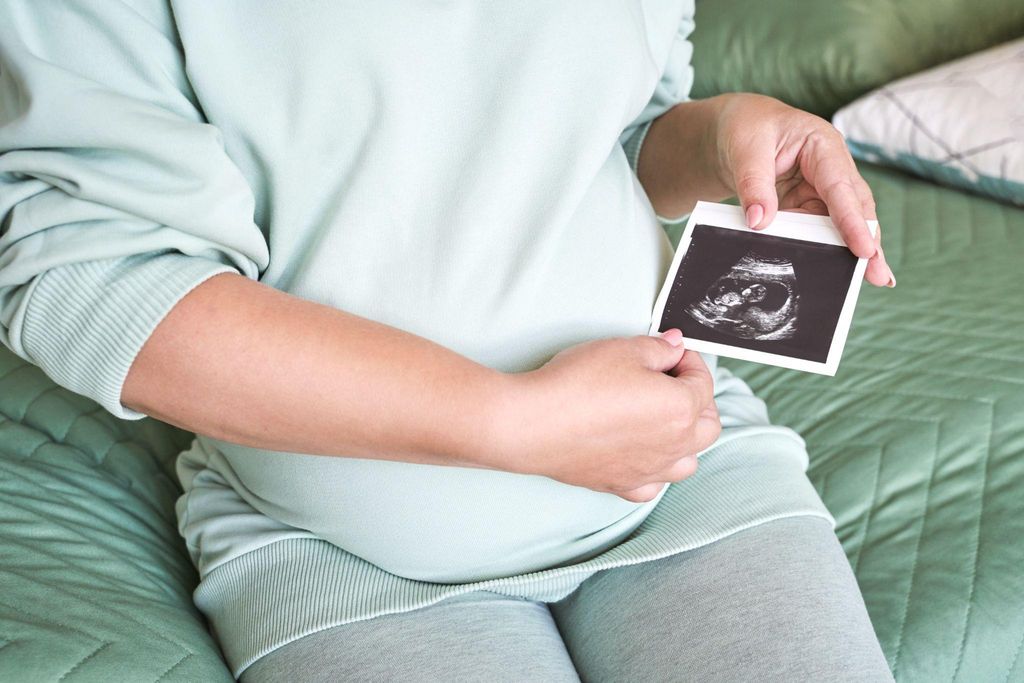 Pregnant woman practicing yoga and relaxation techniques for mental health during pregnancy.