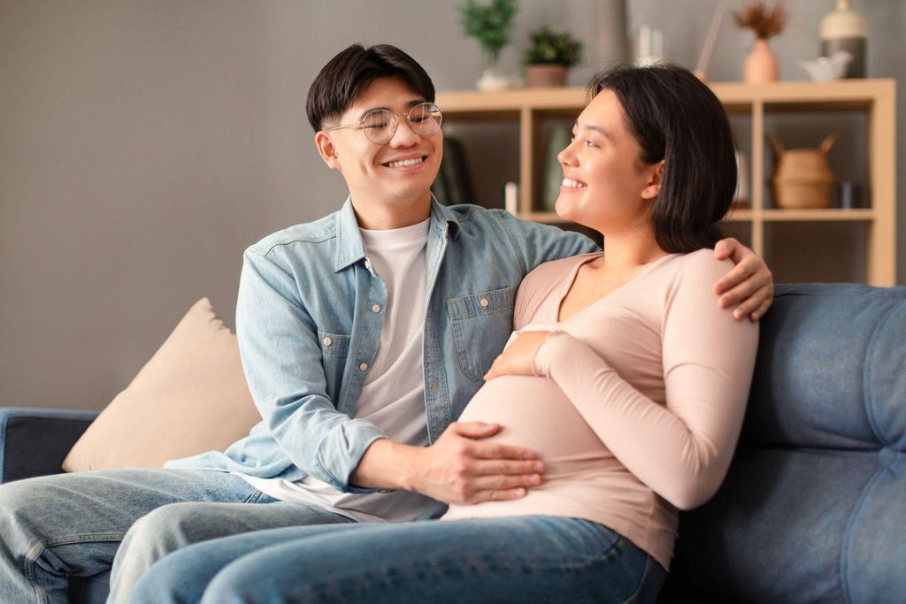 Couple attending pregnancy yoga classes together, bonding and preparing for parenthood.