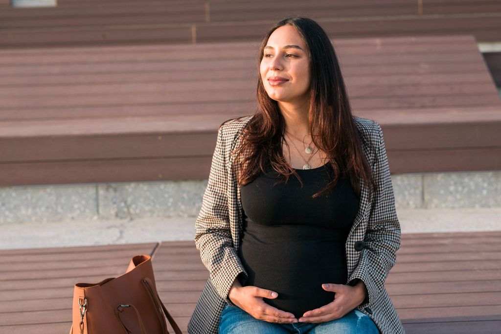 Expectant mother considering an online antenatal self-referral form.