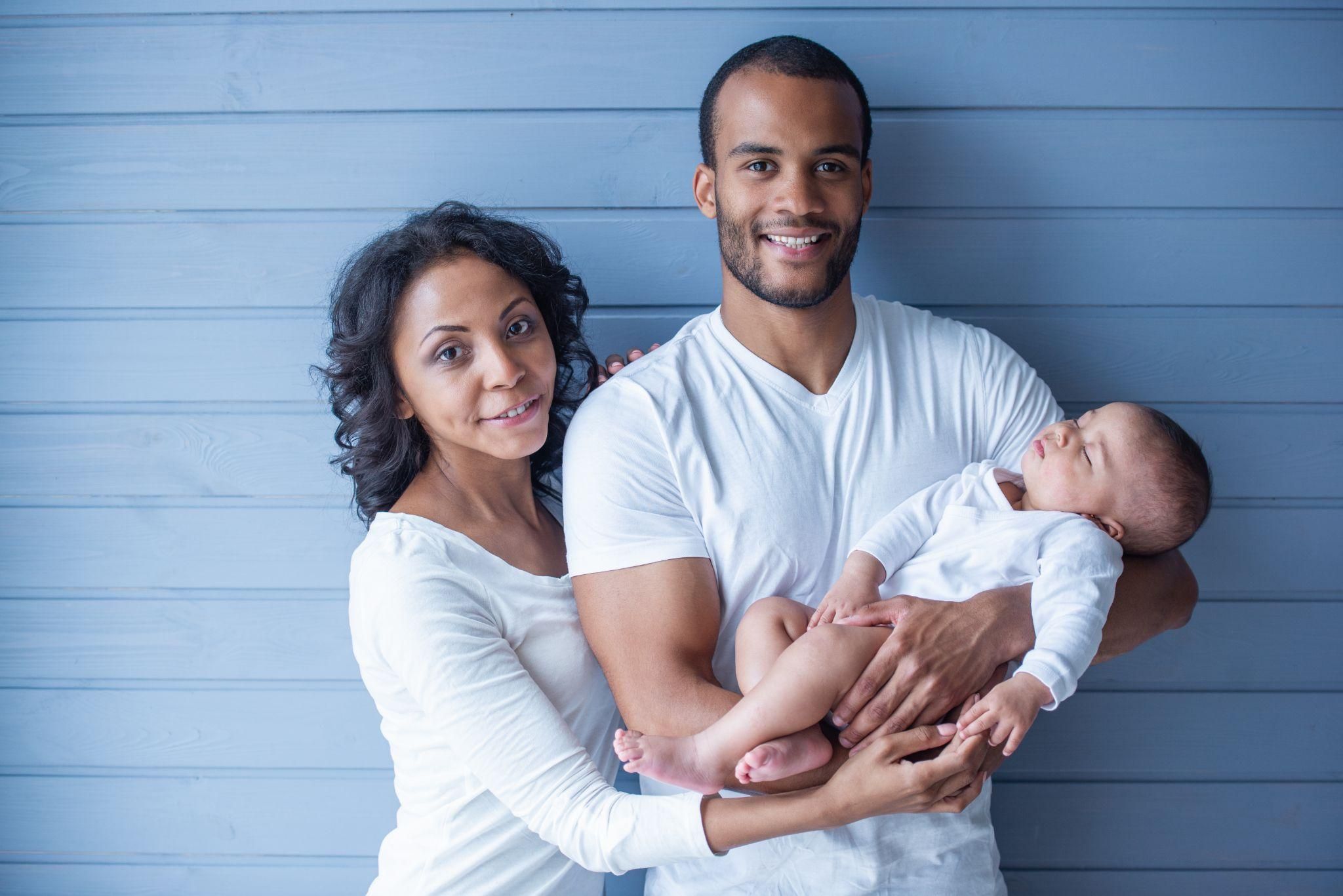 A mother bonding with her newborn and toddler, symbolising the balance of self-care and nurturing both children.