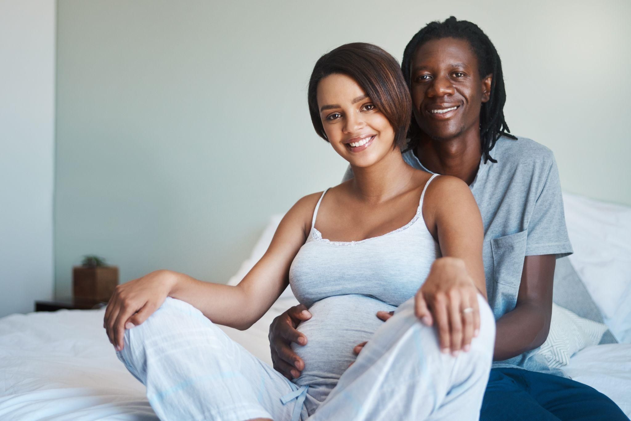 Expectant mother learning about premature birth risks during her antenatal care journey.