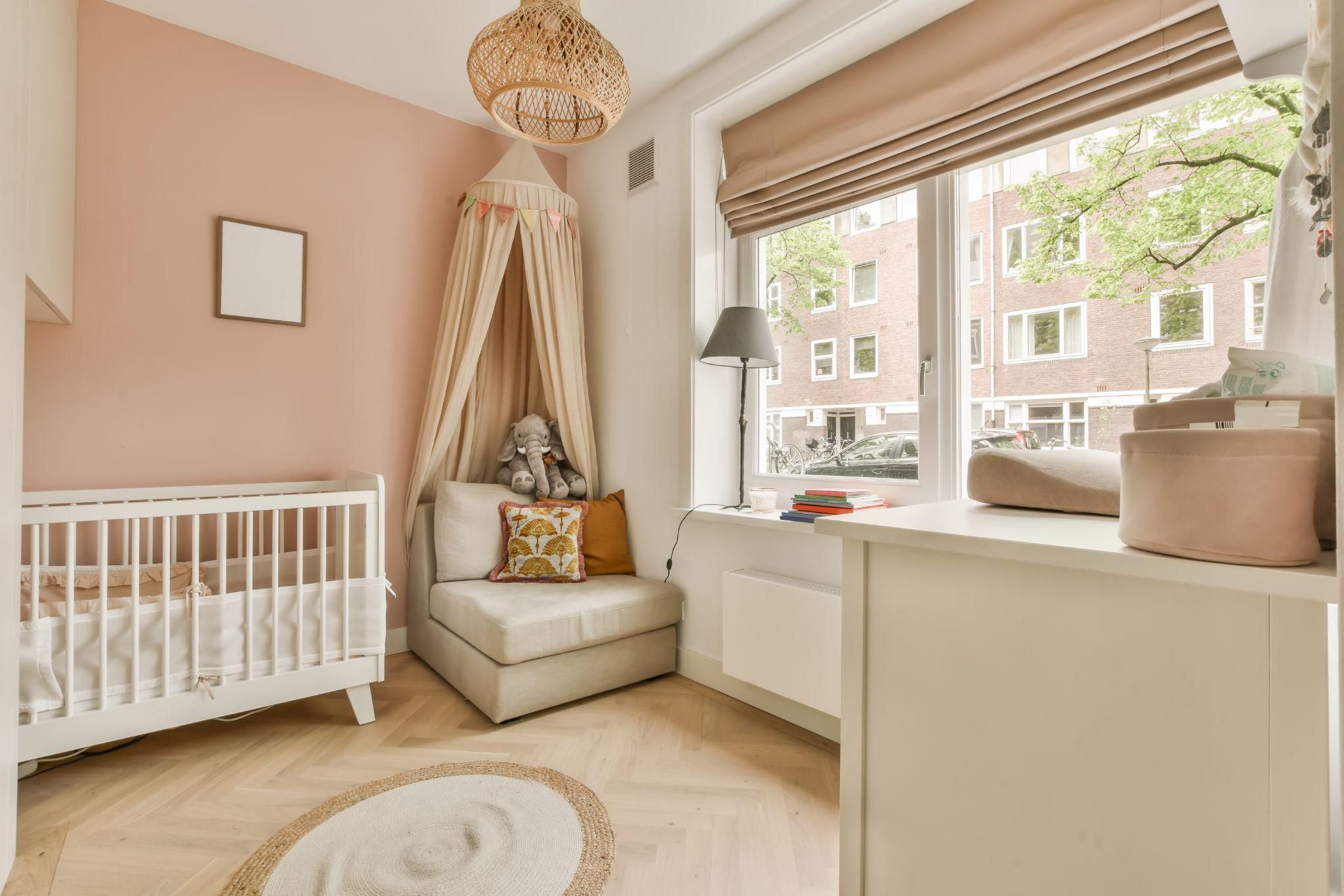 A high-end nursery with elegant decor and practical storage solutions.