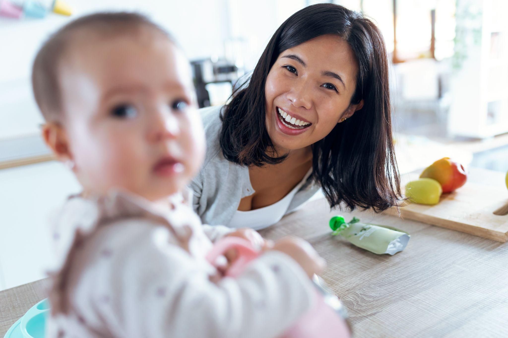 A mother radiating confidence and joy with her newborn.