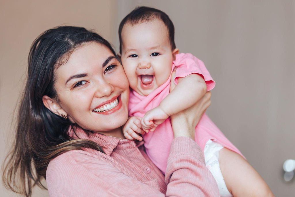 A confident mother embracing her postpartum journey with joy and pride.