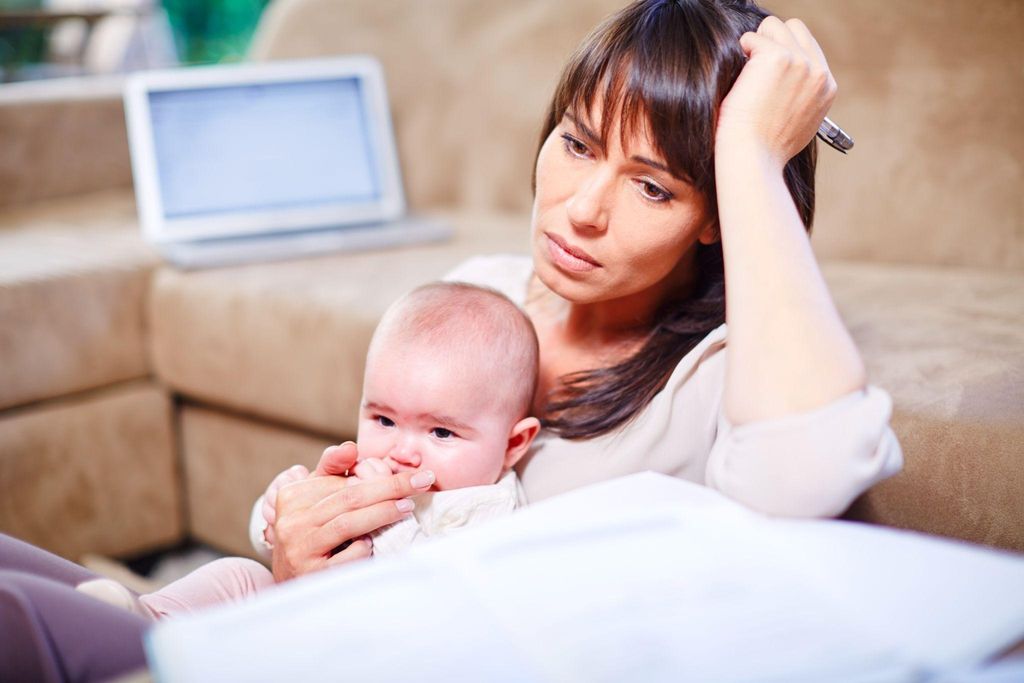 Stressed mum with baby.