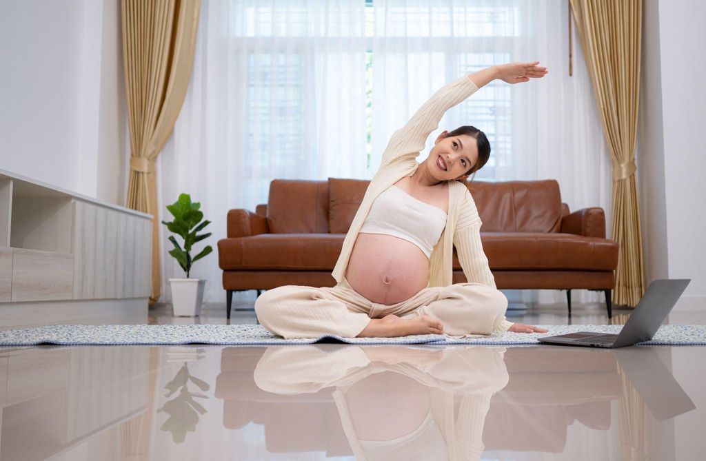 Pregnant woman practising yoga during pregnancy to relieve pelvic pain at night.