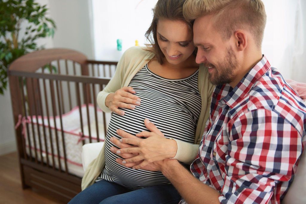 A mother-to-be reviewing her pregnancy care options online.