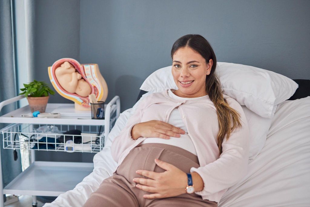 Expectant mother sitting calmly as she awaits the onset of labour past her due date.