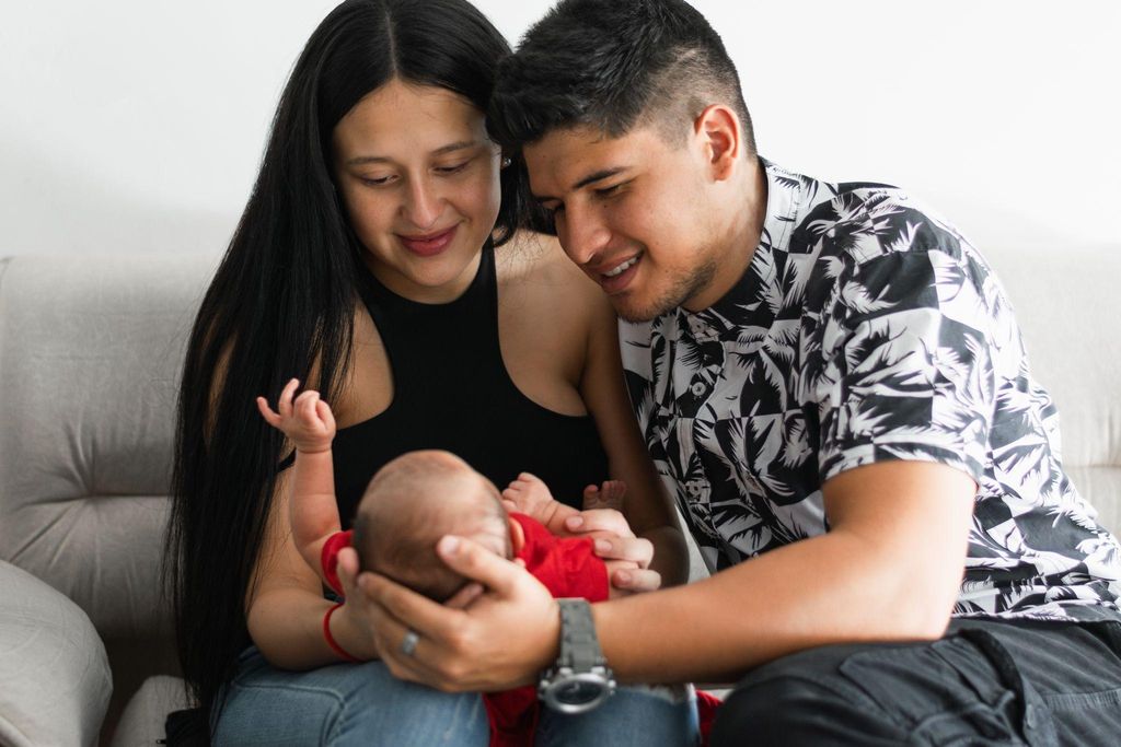 Young parents with newborn.