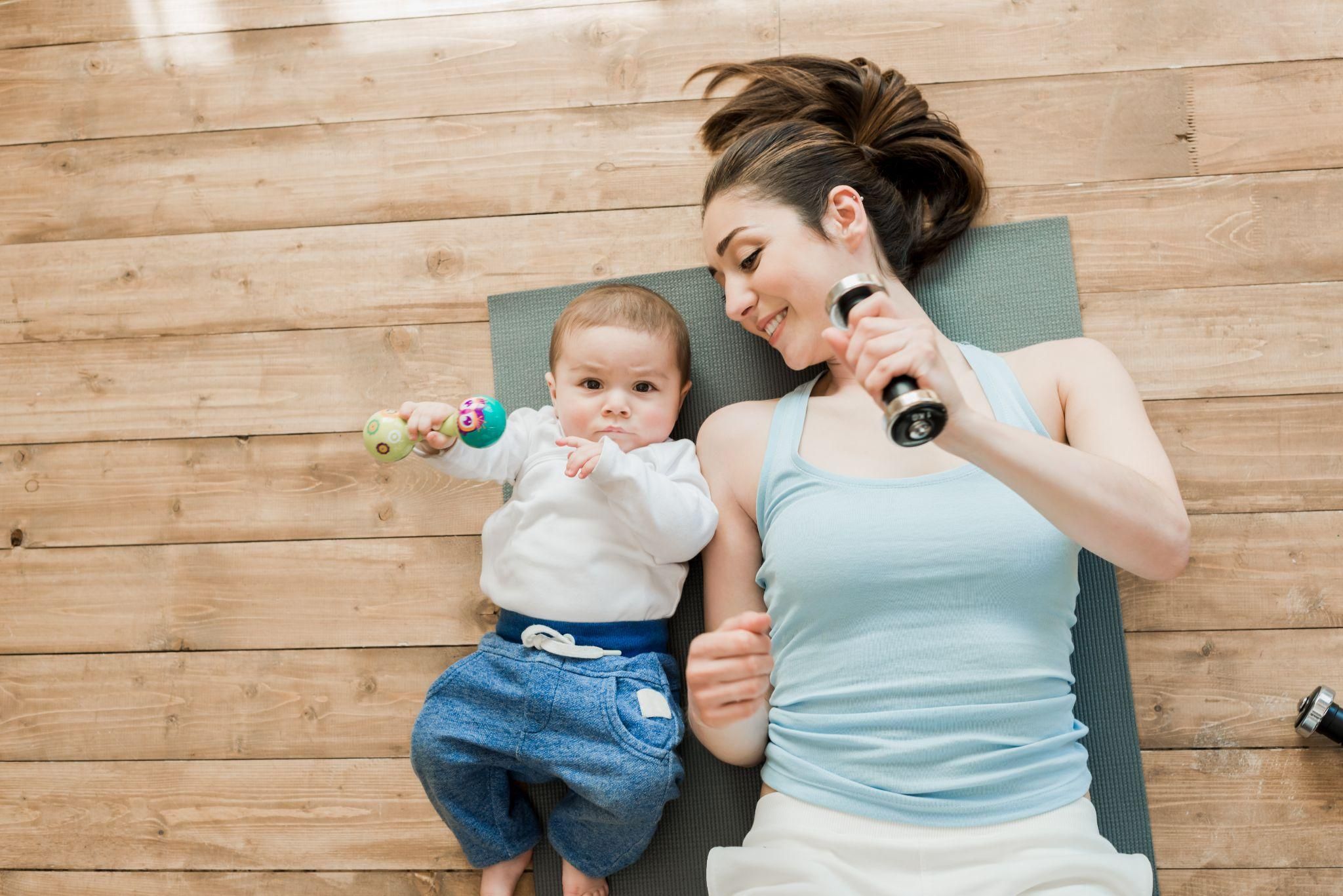 Postpartum woman practising yoga to manage stress and promote recovery.