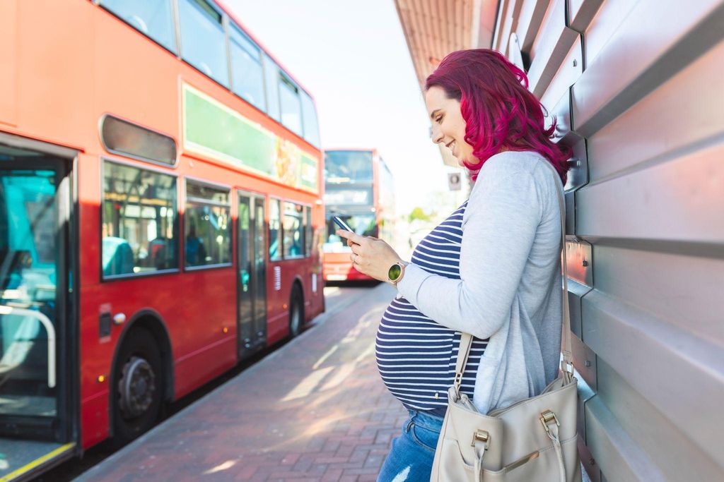 Expectant mother consulting with a midwife during an antenatal appointment in London.