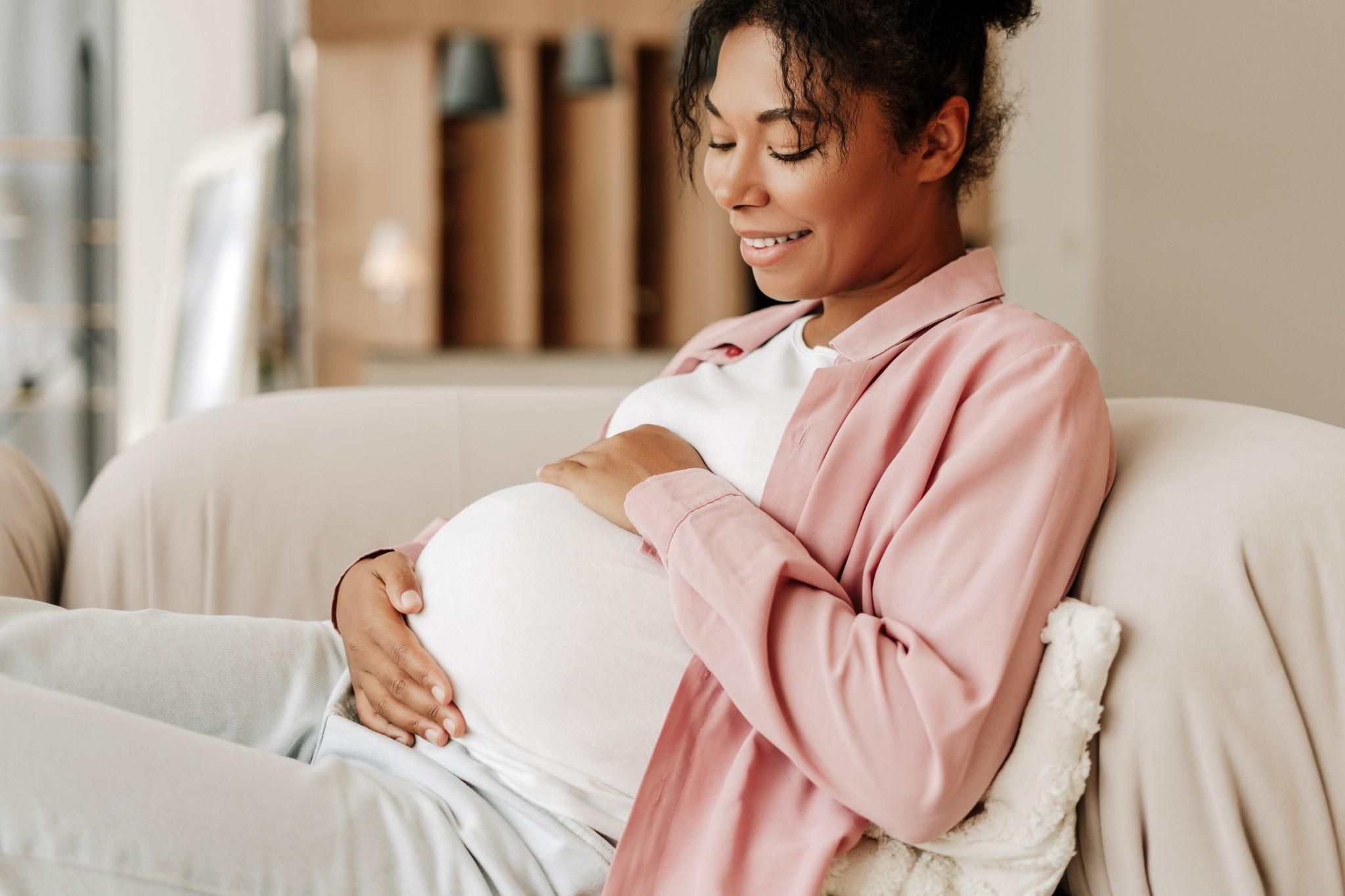 Calm pregnant woman is managing antenatal anxiety with CBT and counselling.