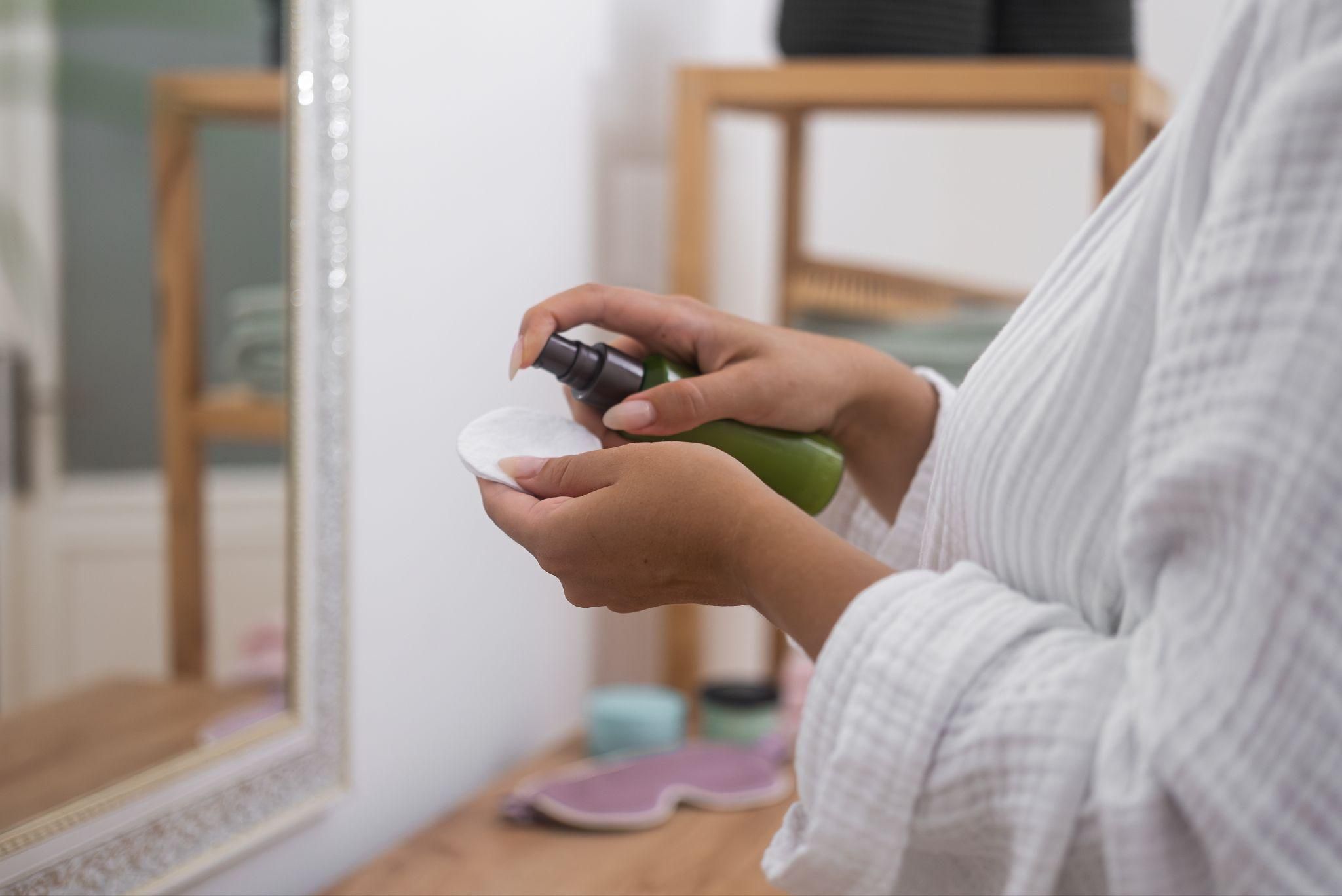 Pregnant woman using safe skincare for acne treatment