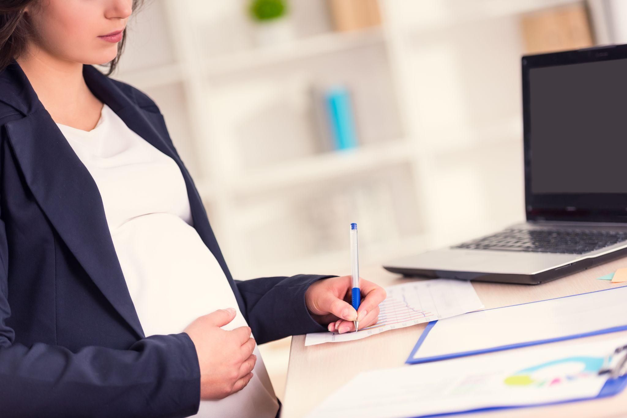 A working mum-to-be balancing antenatal care and career commitments.