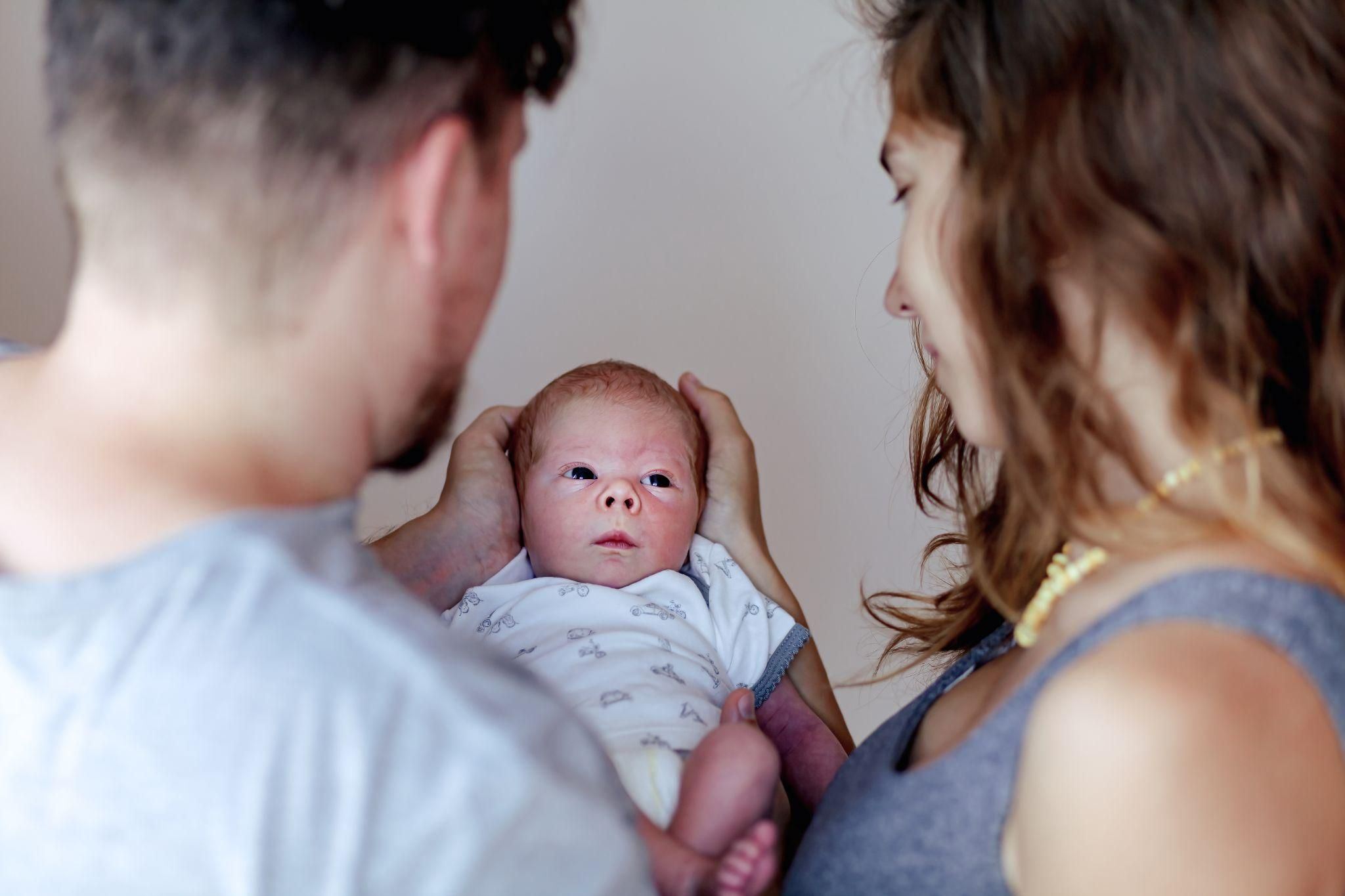 A couple supporting each other during the early stages of parenthood.