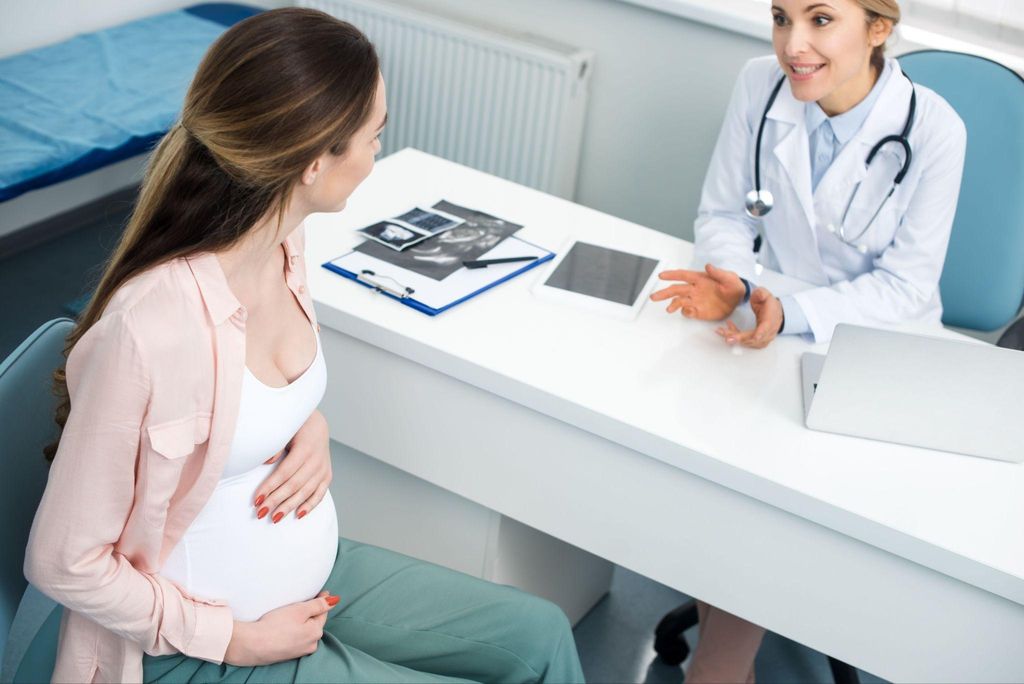 A woman receiving antenatal care after a chemical pregnancy.