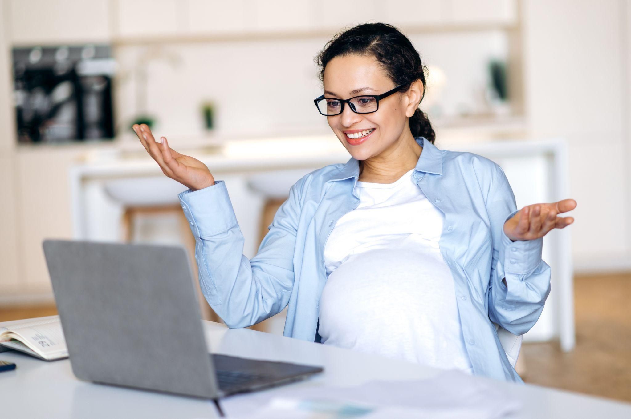 Couple reviewing birth plan and discussing preferences for childbirth and post-birth care.