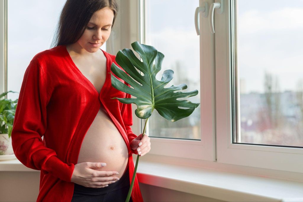 A pregnant woman engaging in yoga to prepare for labour and stay relaxed.