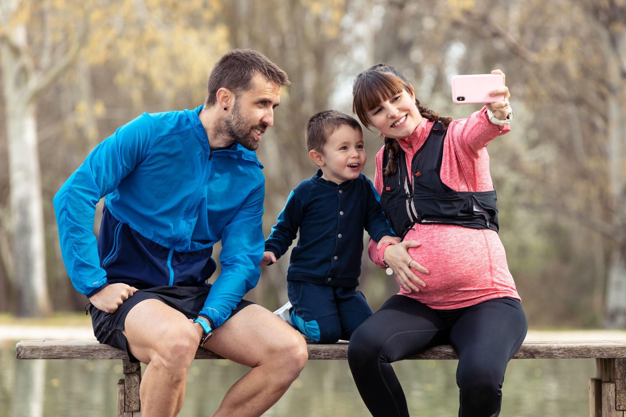 Pregnant mum takes selfie with husband and toddler son.