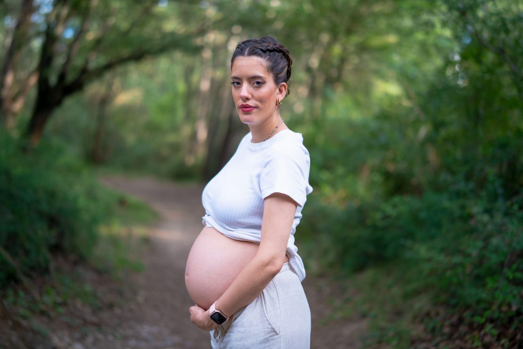 Expectant mother consulting with a midwife at an NHS antenatal clinic in London.