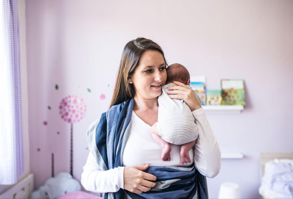 Happy woman with newborn.