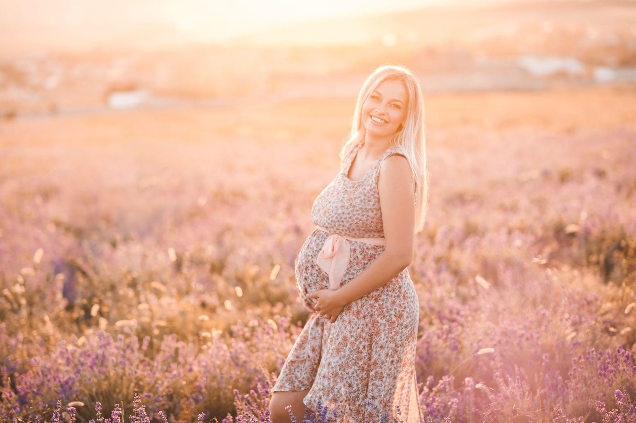 A serene pregnant woman focusing on her breathing.