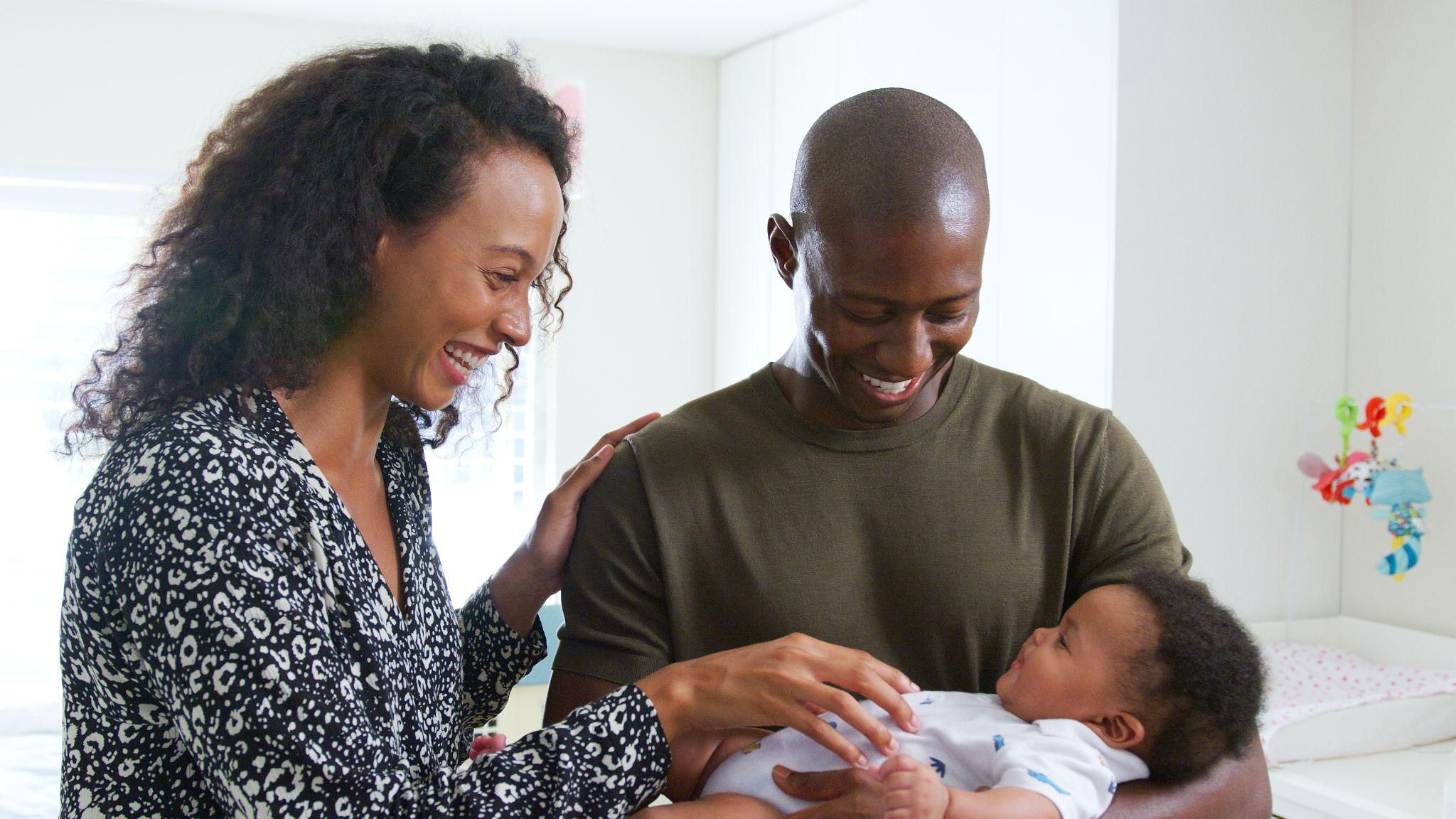 A new father bonding with his baby, embracing the emotional journey of the postpartum period.