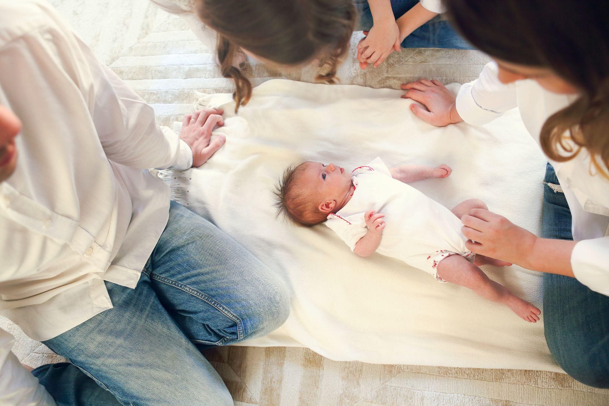 Expectant mother using prenatal yoga and relaxation techniques to prepare for a natural vaginal birth.