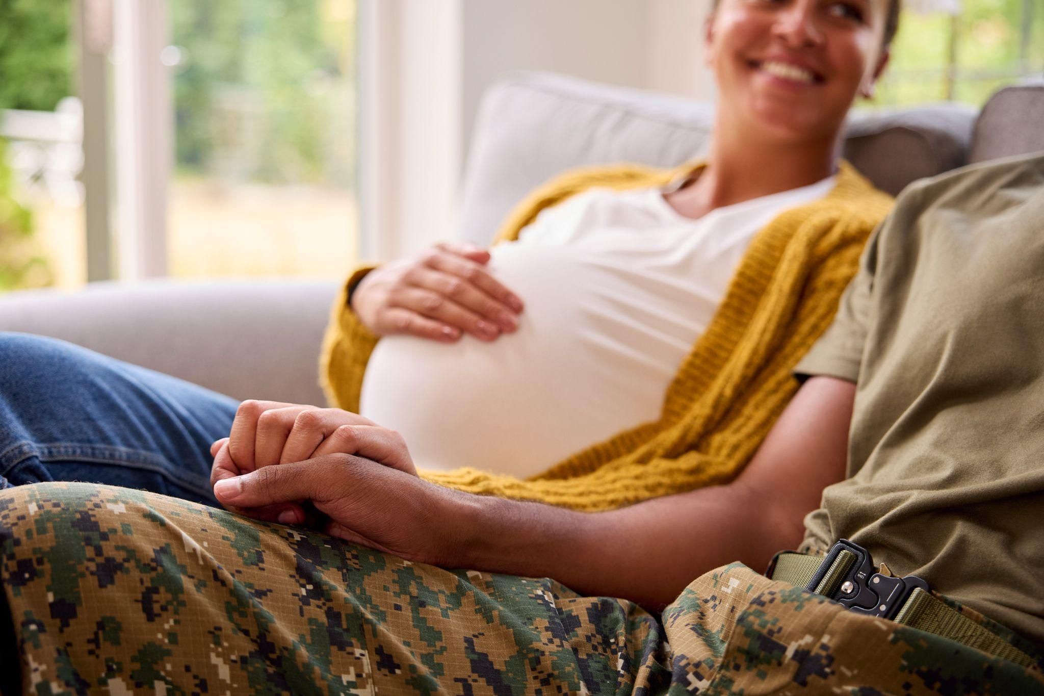 Pregnant woman participating in an online antenatal course from home, gaining knowledge for childbirth and postnatal care.