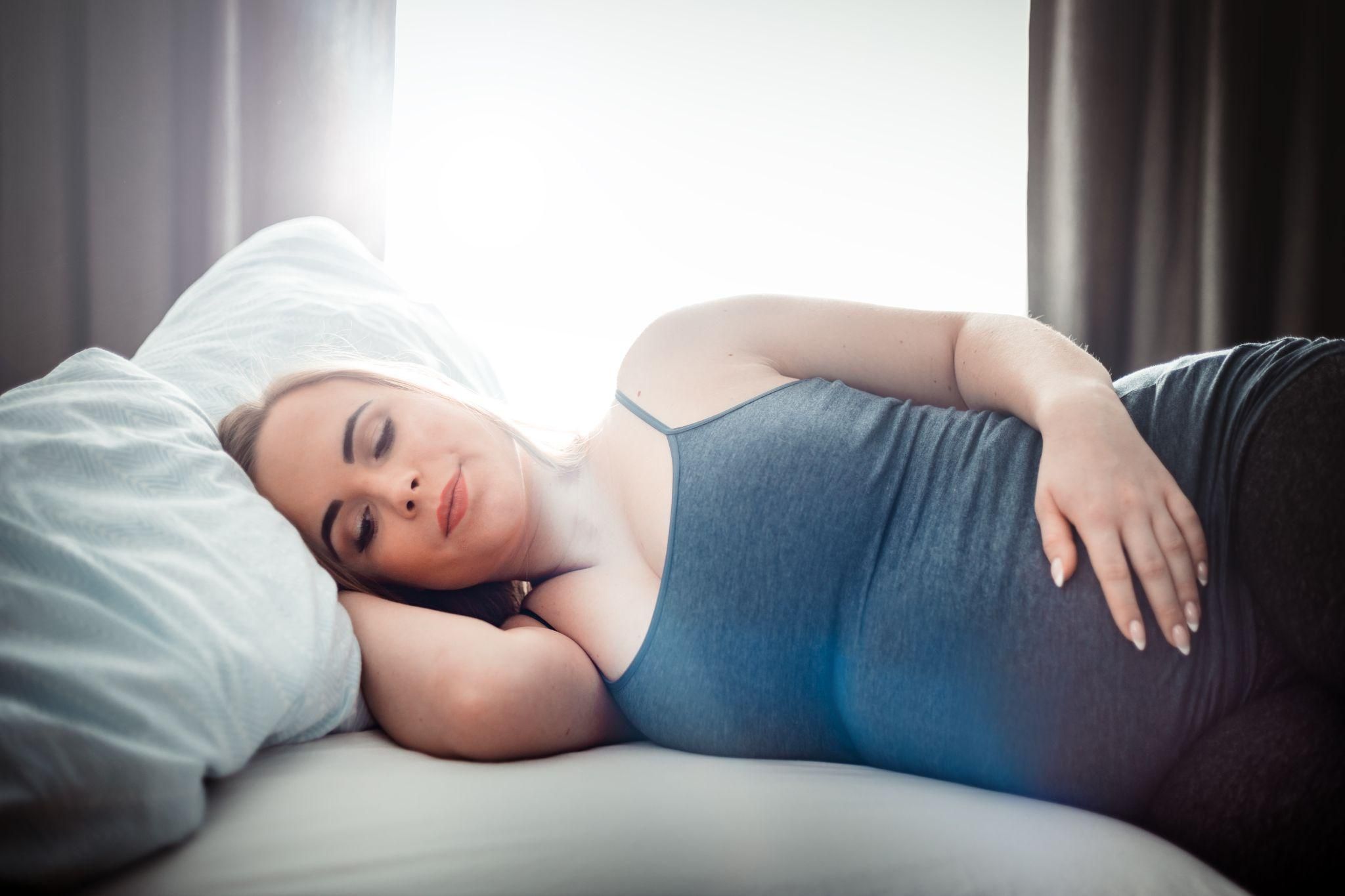 Pregnant woman practicing prenatal yoga to relieve pelvic and joint pain.