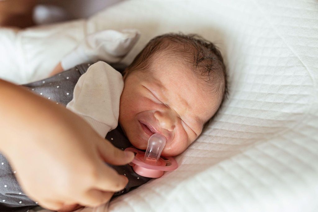 A midwife demonstrating the Kiwi cup during an antenatal class to expectant parents.