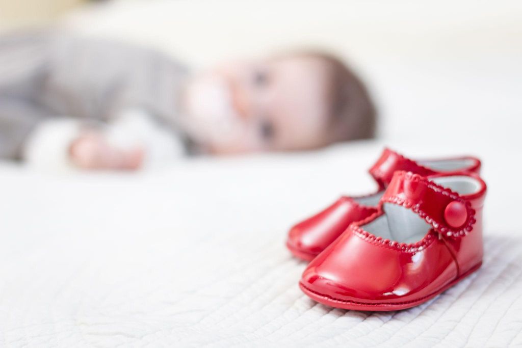 Baby shoes in vibrant colours and different styles, ready for purchase.