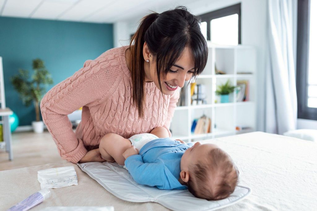 A collection of stylish baby changing bags and portable mats, ready for use.