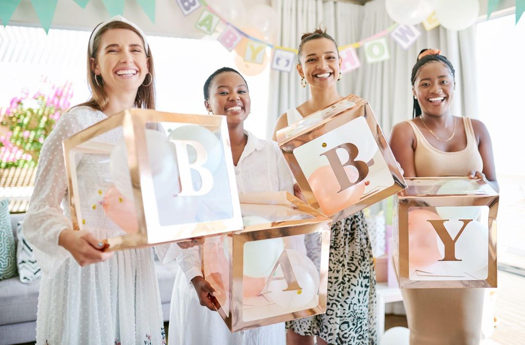 Guests enjoying baby shower games with smiles and laughter.