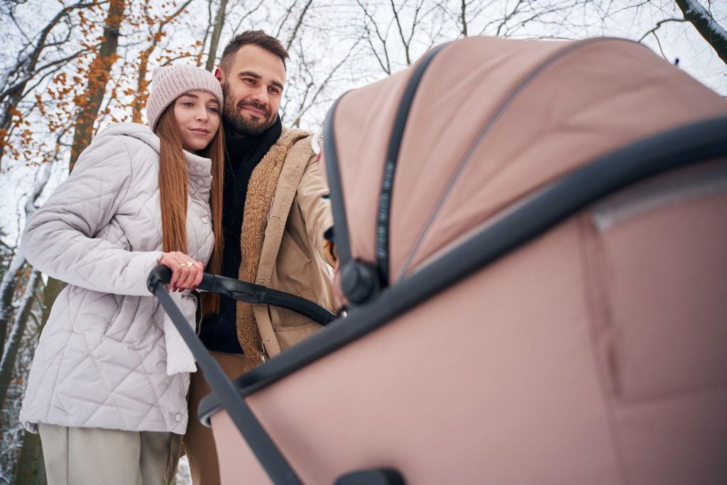 Baby prams of different designs and colours showcased outdoors, ready for parents to choose.